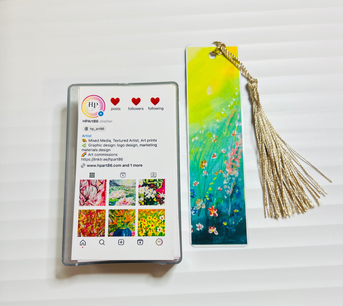 Metal bookmark with green and yellow floral watercolor design and gold tassel
