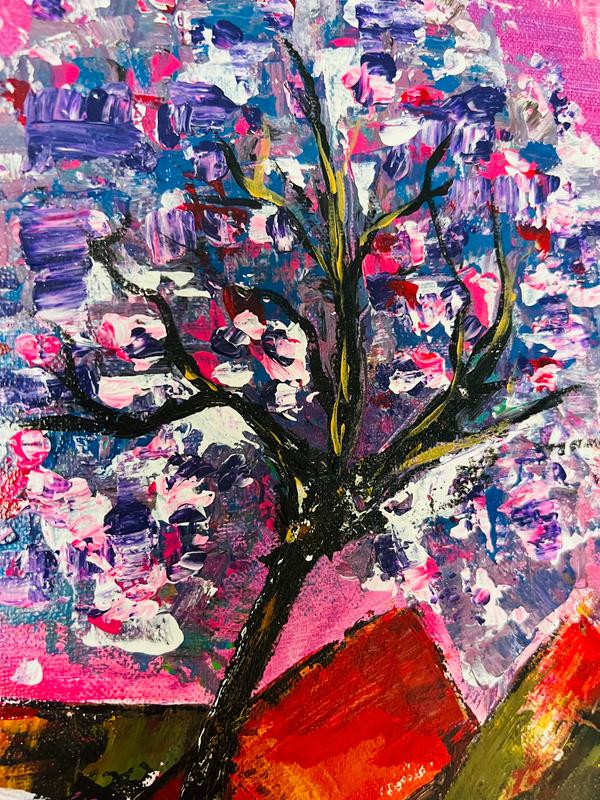 Close-up of abstract flowering tree artwork with bold pink, blue, and orange paint layers.