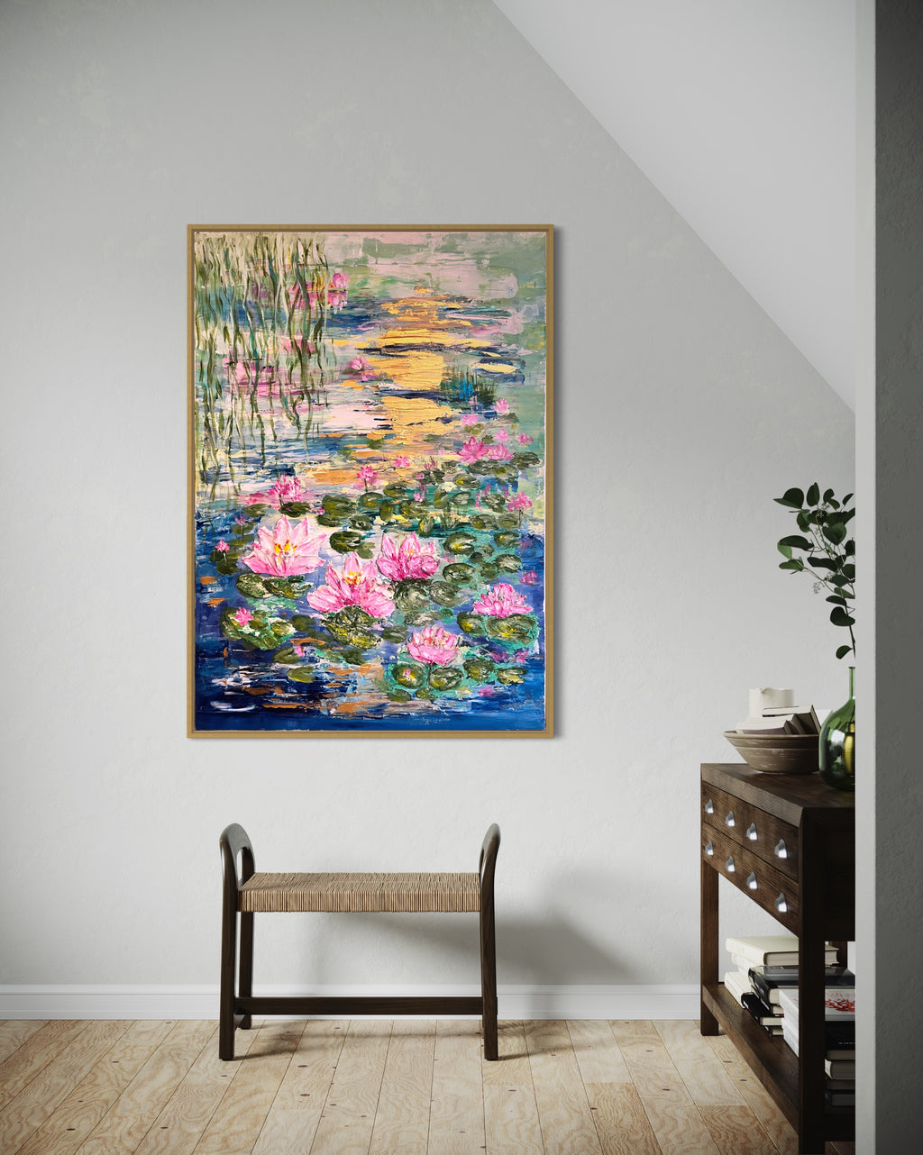 Framed textured painting featuring pink water lilies and green pads across a blue-green pond