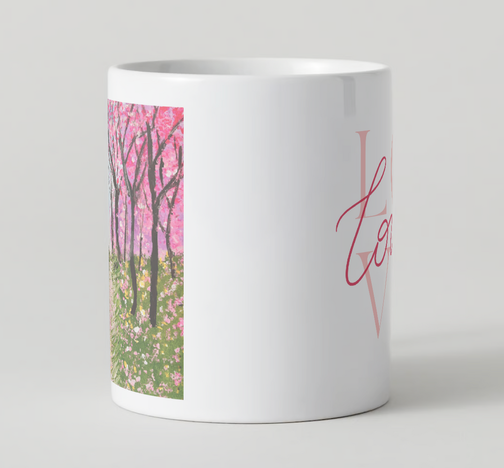 White ceramic mug showing side panel cherry blossom print and pink “Love” script