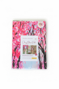 18x26 inch polyester kitchen towel featuring a vibrant pink cherry blossom painting print in clear plastic packaging.