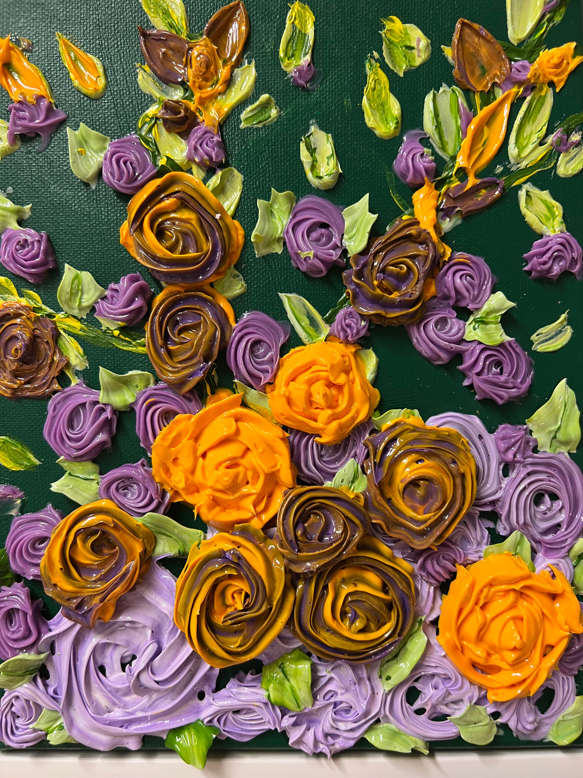 Textured rose wall art panel with purple and orange rosettes, gold curls, and green leaf accents