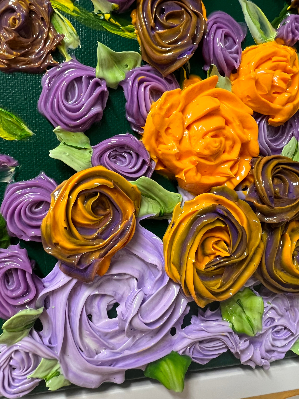 Textured floral wall art with raised purple, yellow, and orange roses and green leaves