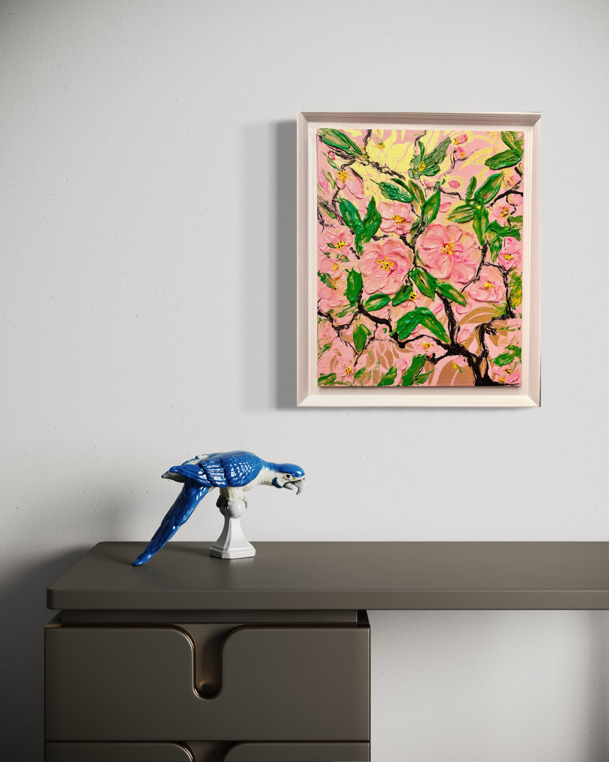 Framed spring cherry blossom painting displayed on a wall