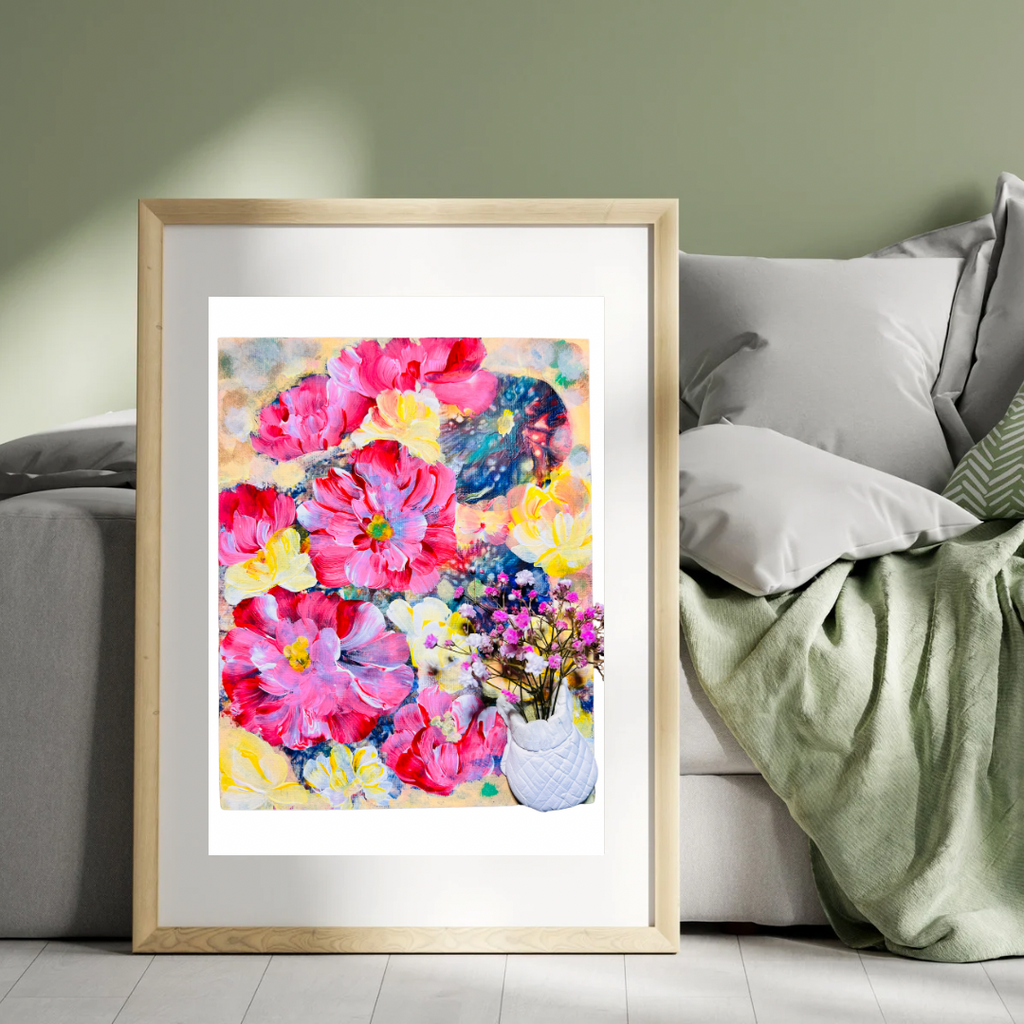 Framed floral wall art print with pink flowers and a white quilted vase