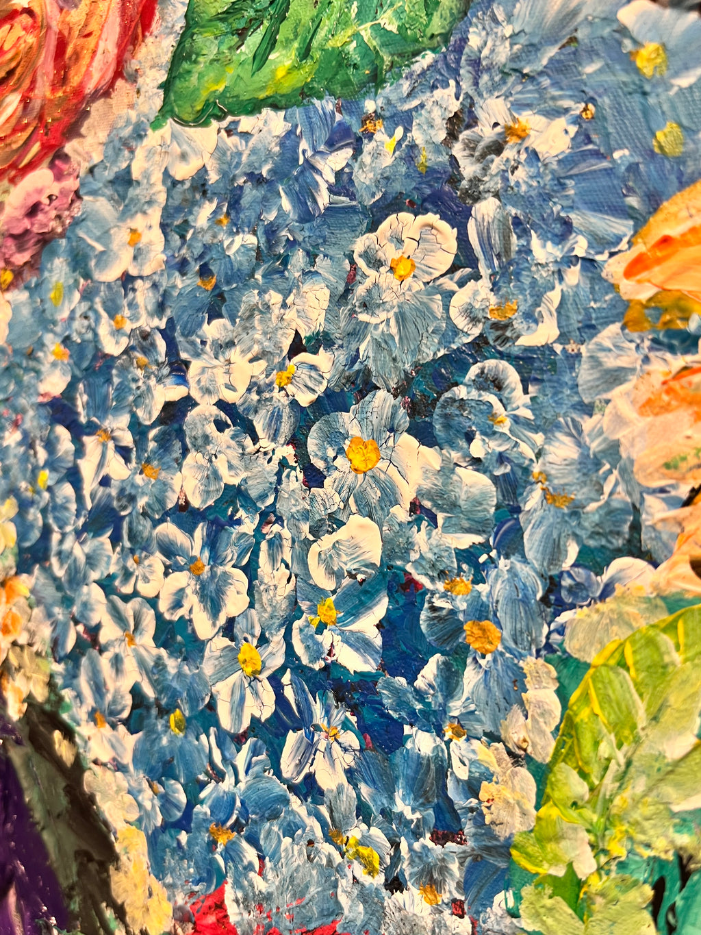 Textured floral mixed media painting with blue daisies and soft pastel foliage