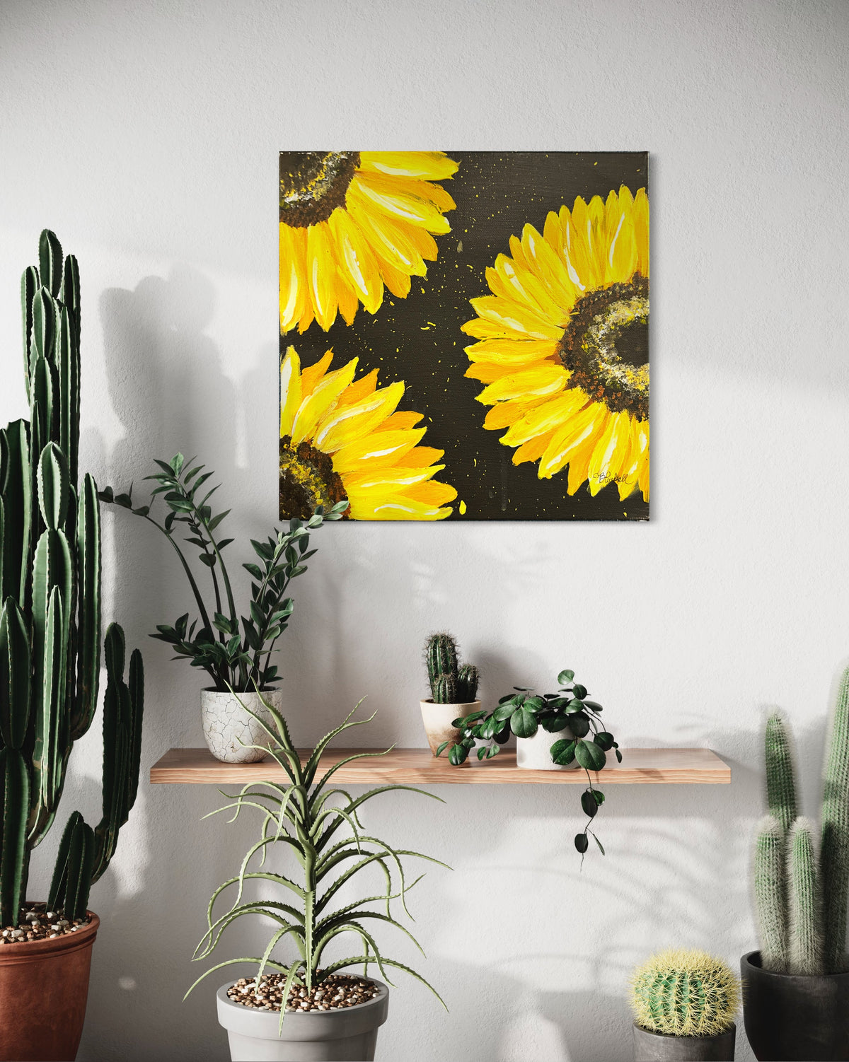 Framed sunflower wall art with bright yellow blooms on dark textured background.