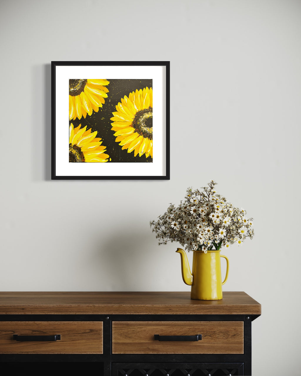 Black-framed sunflower print with yellow blooms on dark speckled background.