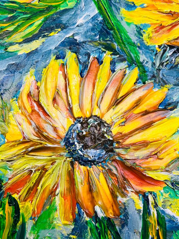 Close-up of framed sunflower painting showing a large yellow bloom and green leaves.