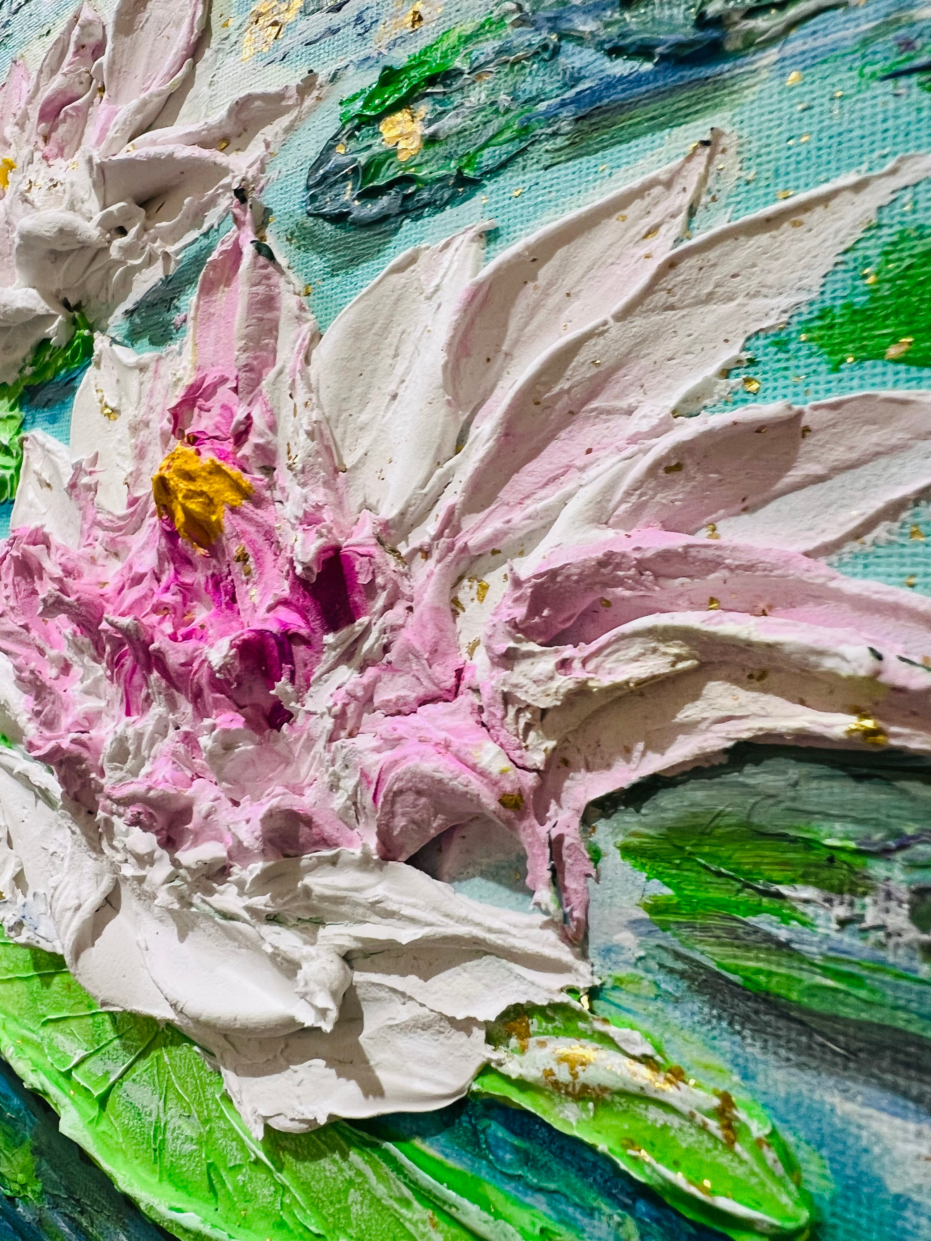 Textured close-up of white and pink waterlily petals with green lily pads and blue water