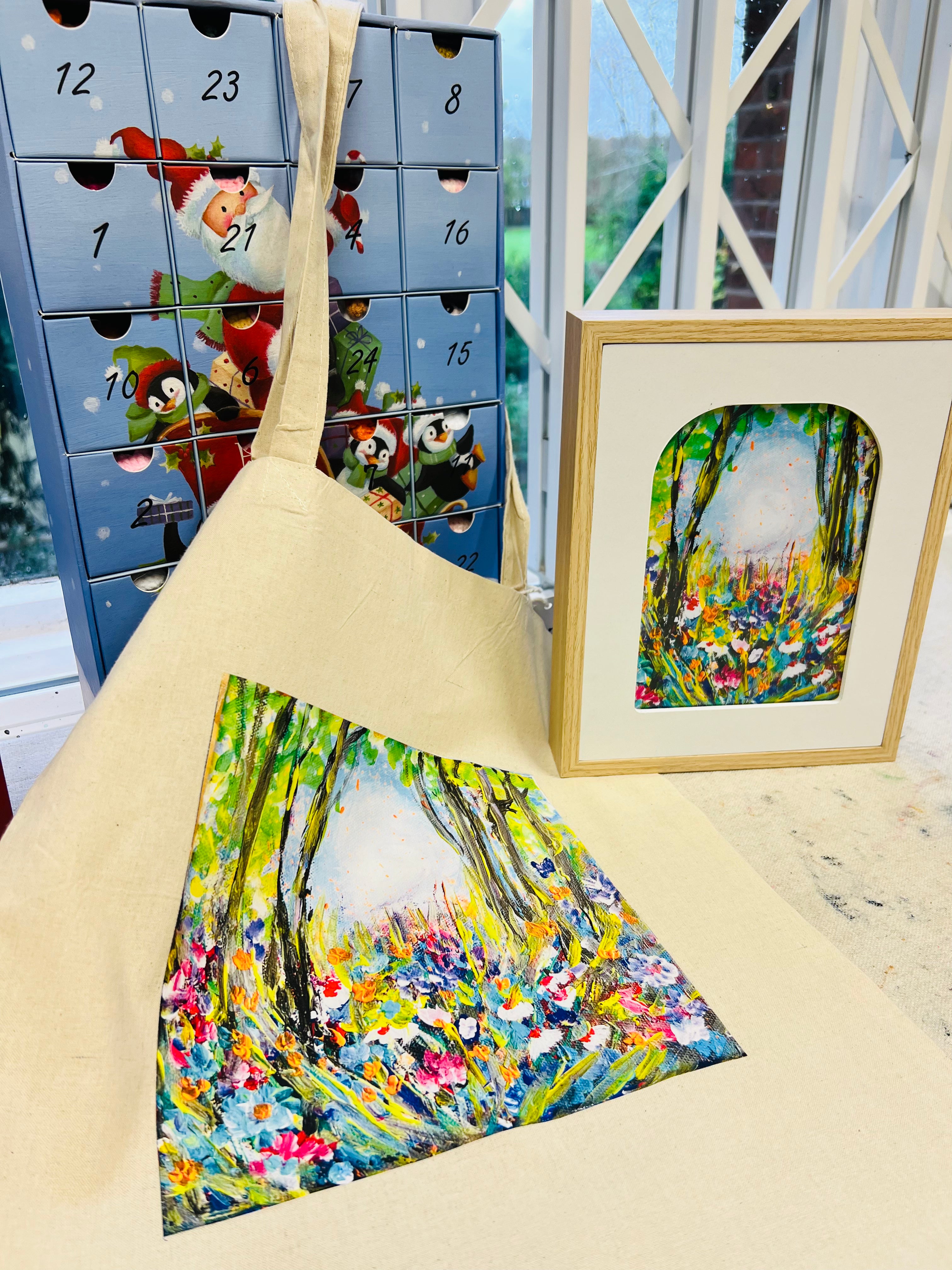 Symphony of Flowers gift set featuring a framed art print and a cotton canvas tote bag with vibrant floral forest artwork.