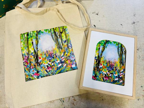 Symphony of Flowers gift set with a cotton canvas tote and a framed 13x18cm art print featuring a vibrant floral forest painting.