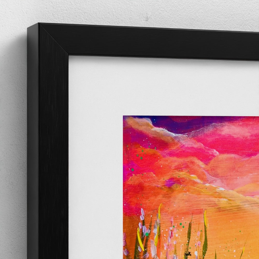 Framed art print with black frame, close view of vivid sunset sky and field grass
