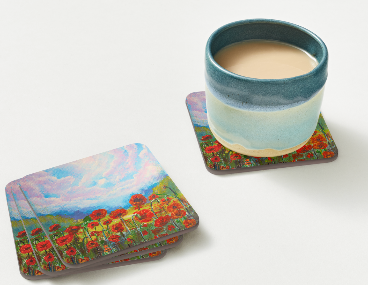 Single 9.5cm art coaster featuring a painted red poppy field with a golden meadow and dramatic pink and blue cloudscape