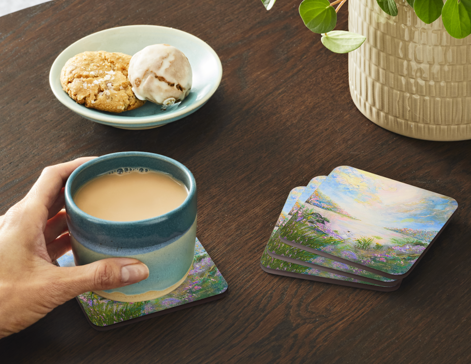 Set of four  9.5cm art coaster featuring a painted swan lake scene with wildflowers and a glowing pastel sky