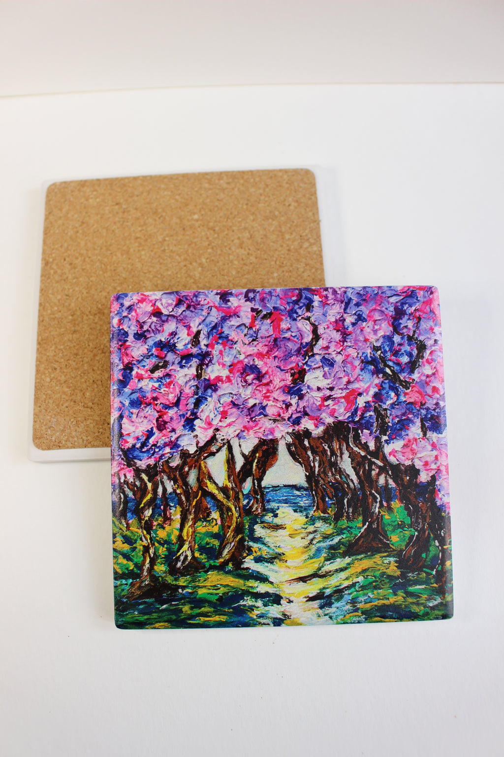 10x10cm square ceramic coaster featuring a vibrant Cherry Road art print with cork backing on a white background.