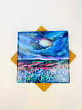 Square ceramic coaster with colorful galaxy abstract art in blue, pink, and green
