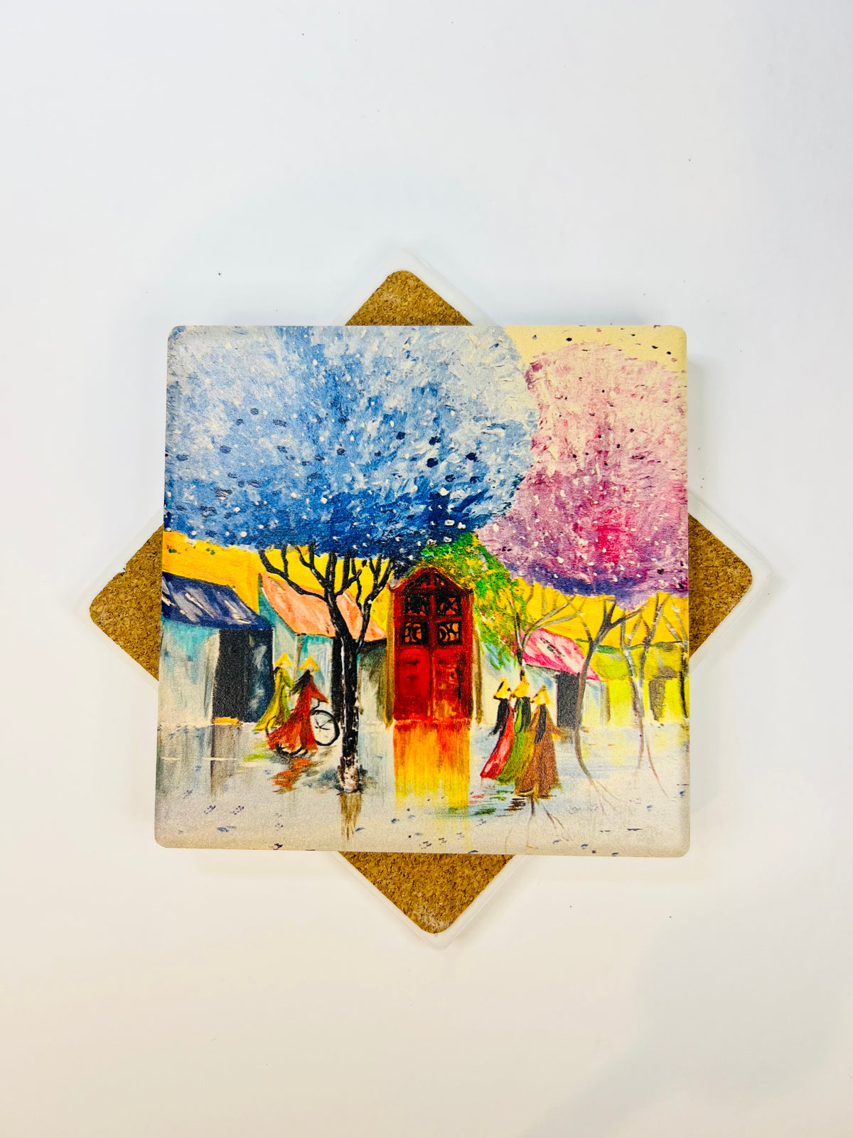 Square ceramic coaster with cork backing and watercolor-style street art print