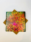 Square ceramic coaster with vivid radial burst print and cork cross corners