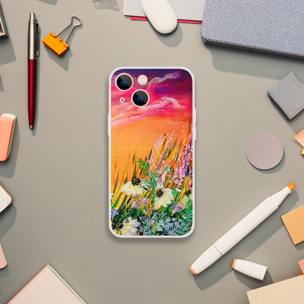 Flexible phone case featuring a vibrant Symphony of Nature floral art print on a frosty transparent background.