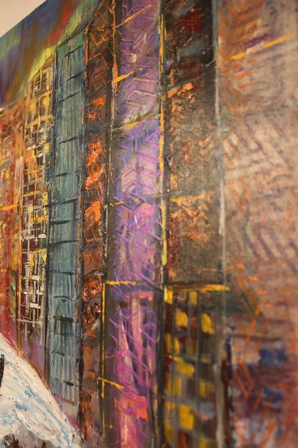 Abstract textured cityscape wall art with vertical teal, orange, purple, and gold blocks.
