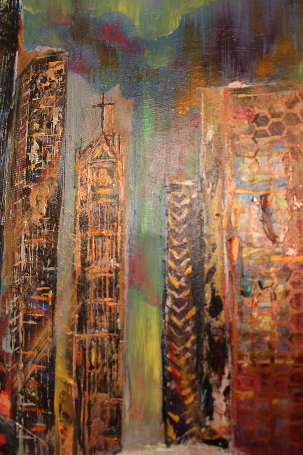 Abstract textured wall art with tall columns and patterned shapes in orange, teal, and pink.