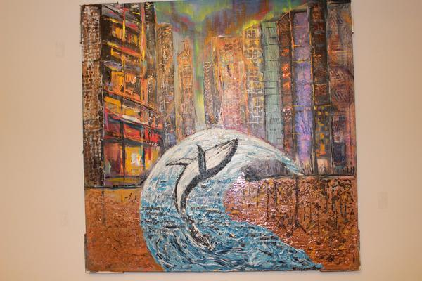 Abstract wall art painting with white-and-blue dolphin over warm orange building textures