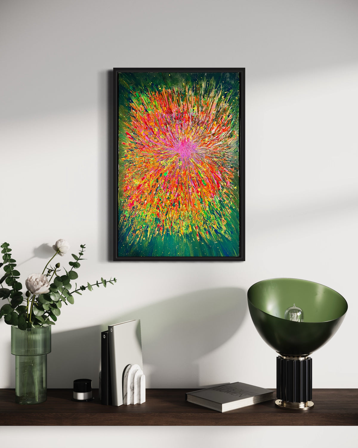 Framed abstract burst art with bright multicolor streaks and a black frame.