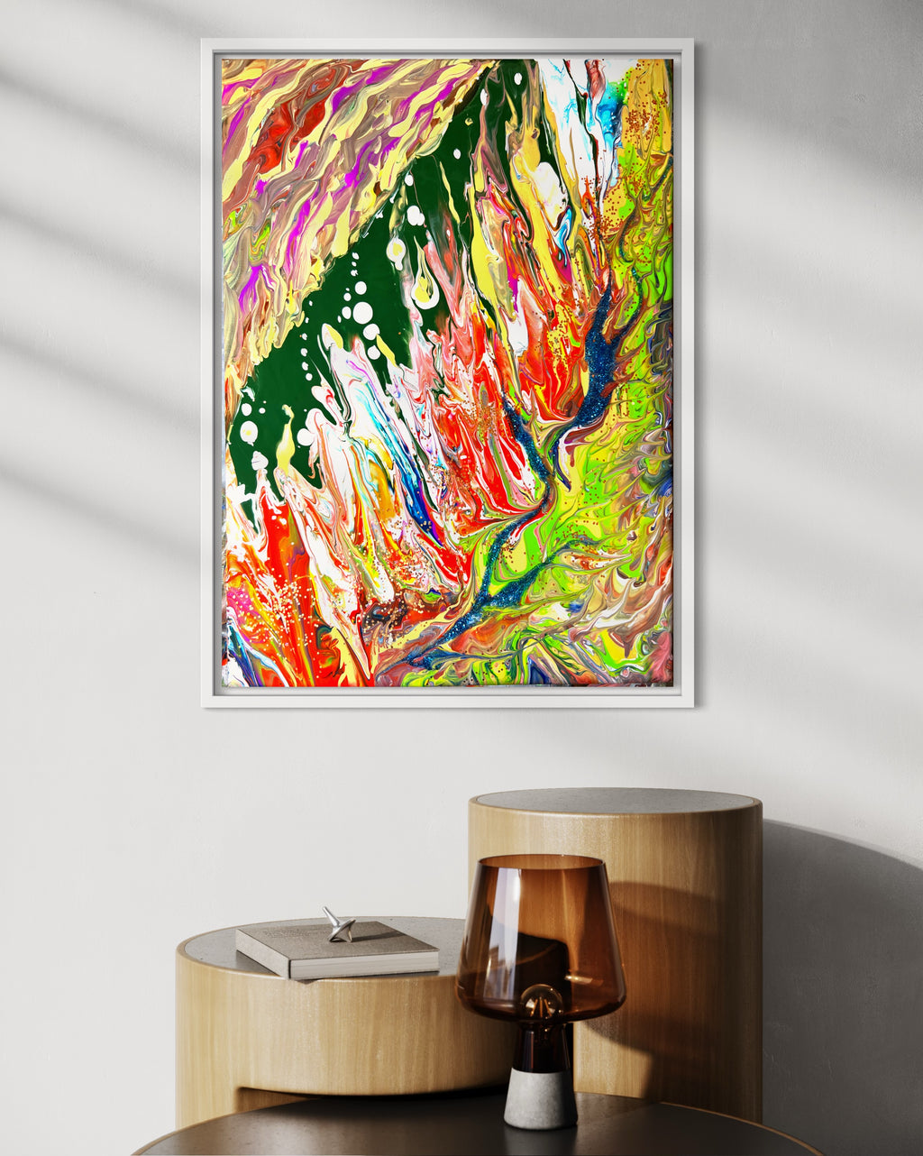 Framed abstract wall art print featuring flowing green, orange, red, and blue paint swirls