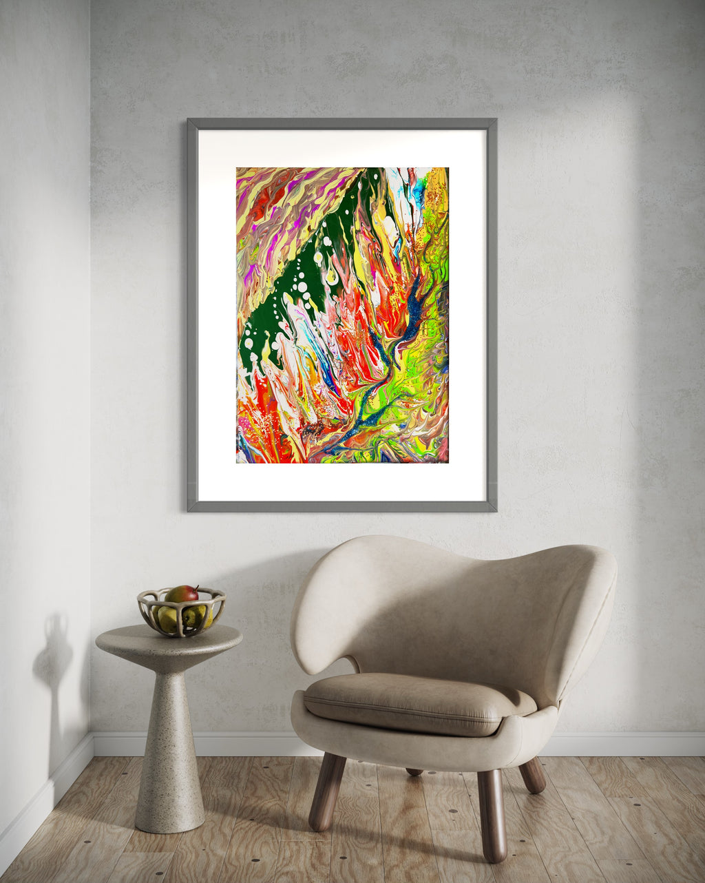Framed abstract wall art print with bright multicolor paint drips against a light room wall