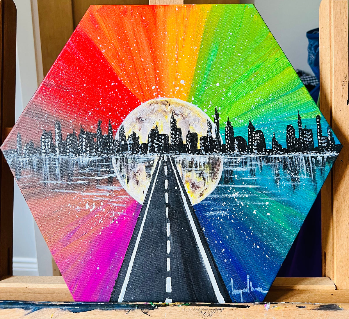 Moon City octagon wall art with rainbow road, city skyline silhouettes, and moon centerpiece