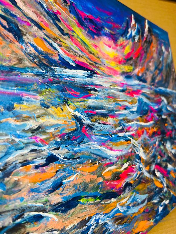 Abstract canvas painting close-up with bright blue, magenta, and yellow brushstrokes