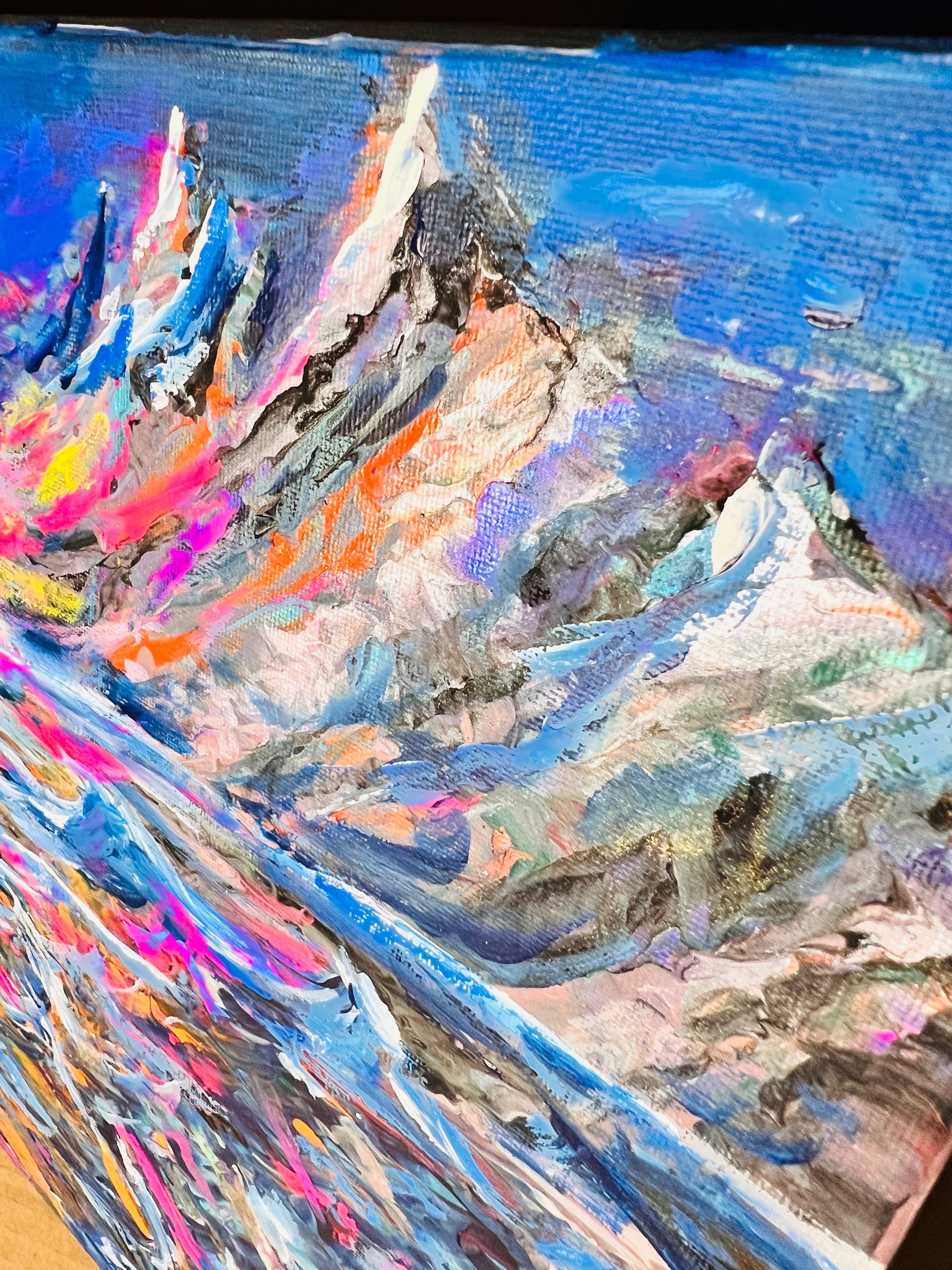 Abstract canvas painting showing layered blue waves with white highlights and colorful accents