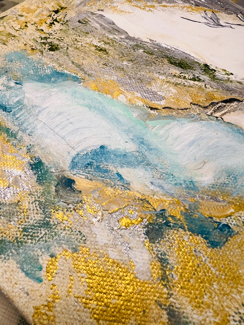 Textured abstract landscape canvas with blue river, yellow speckles, and layered gray rocks