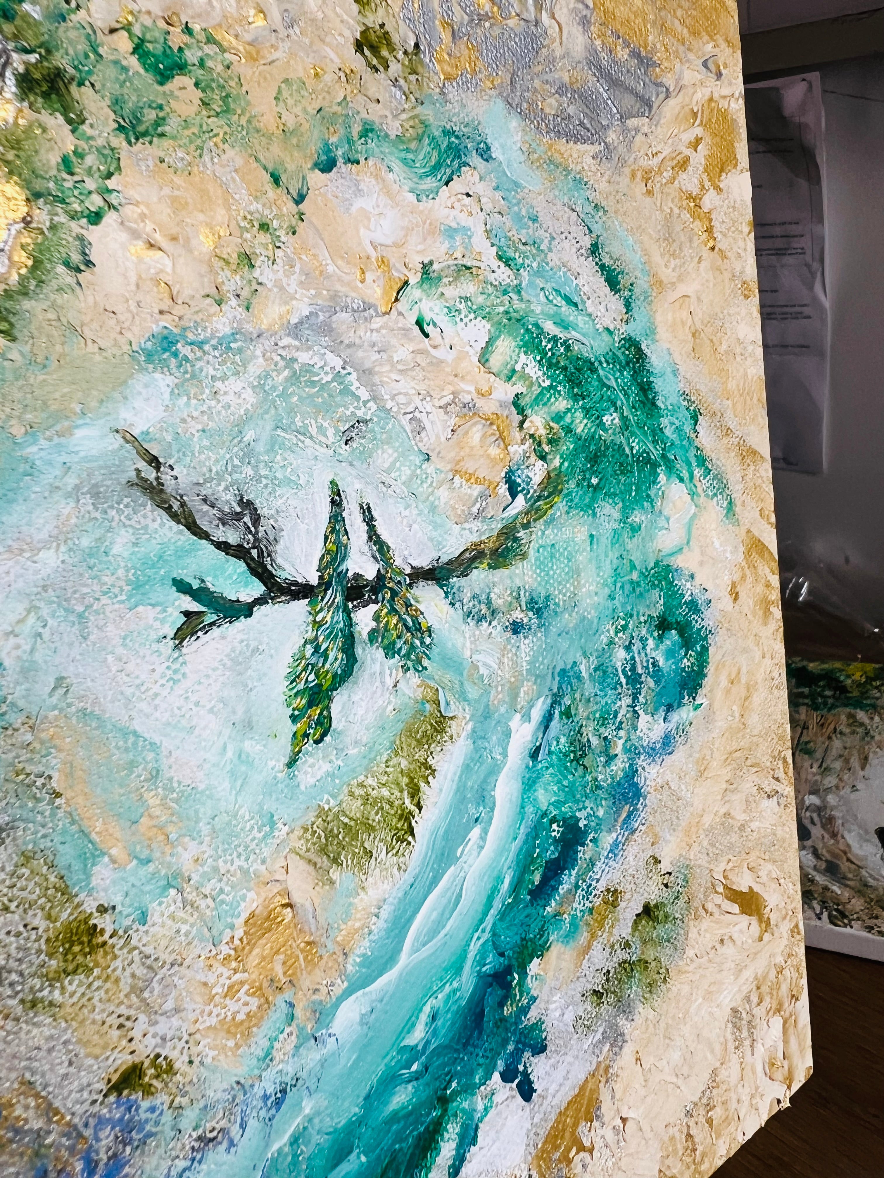 Abstract canvas wall art with turquoise river and green birds, shown on display
