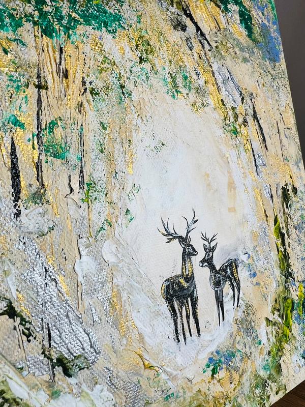 Canvas wall art showing small deer silhouettes near the lower center