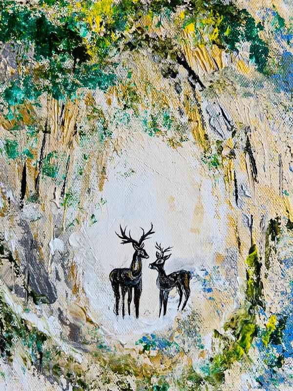Framed canvas wall art featuring two deer silhouettes against textured trees