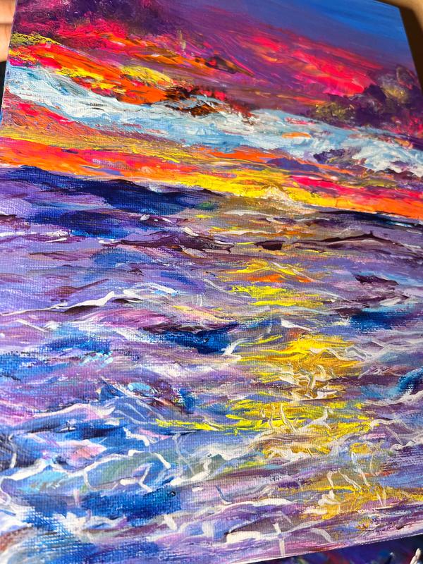 Abstract landscape wall art close-up with yellow streaks over blue and purple paint