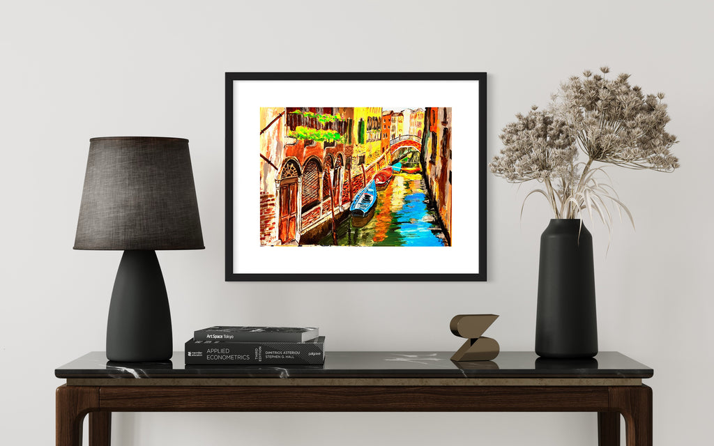 Black-framed Venice canal art print with blue gondola and colorful buildings