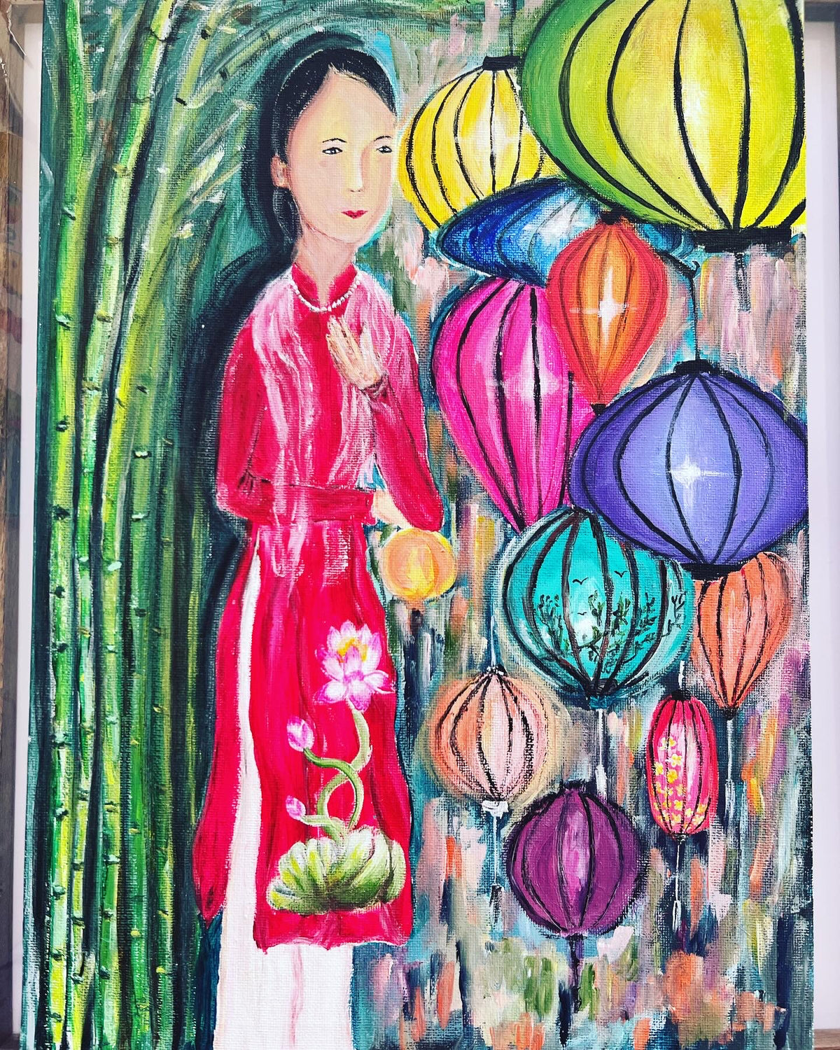 Acrylic on canvas painting of a Vietnamese woman in a red dress with colorful lanterns