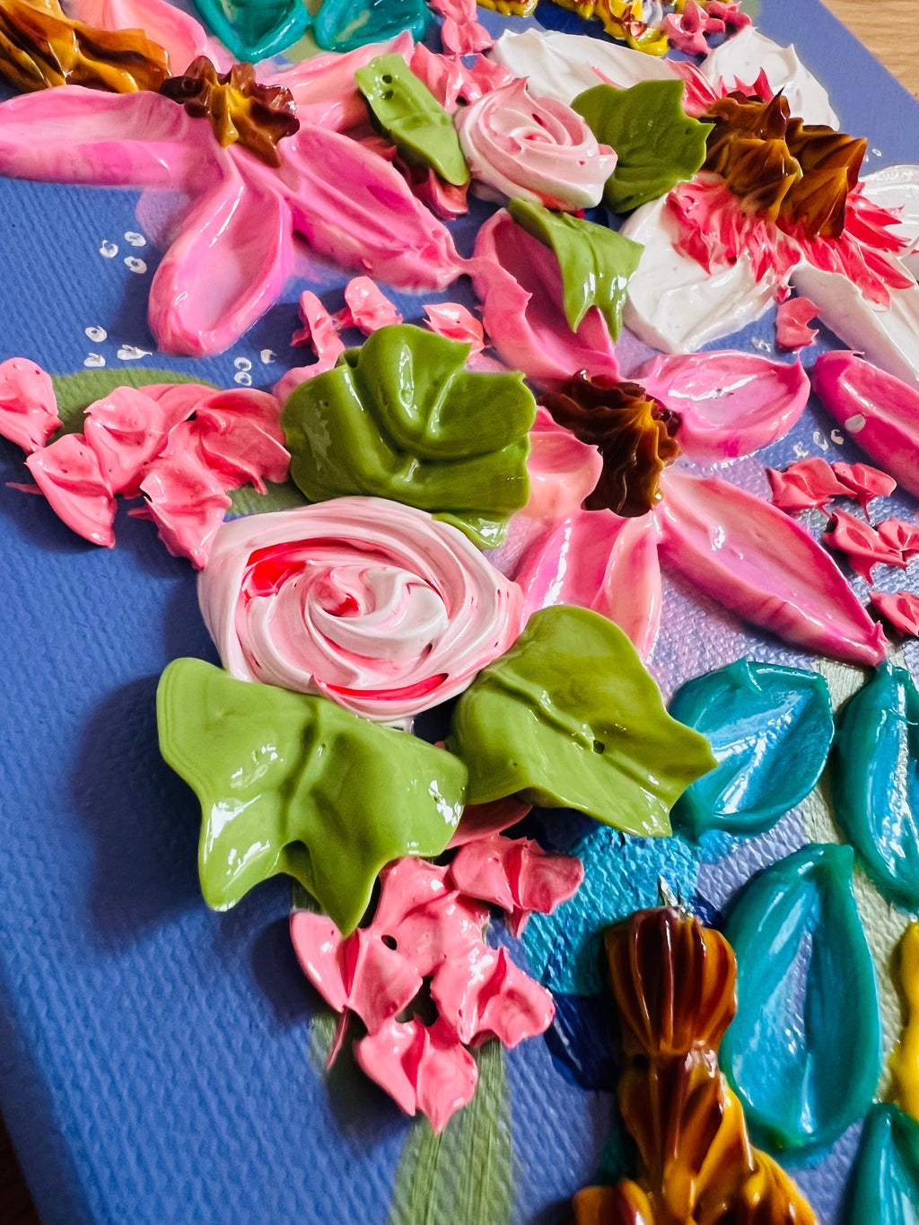 Framed heavy textured floral artwork, close-up of pink roses and green leaves