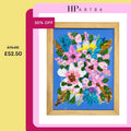 Framed heavy textured floral artwork with pink and green flowers in blue center, wood frame