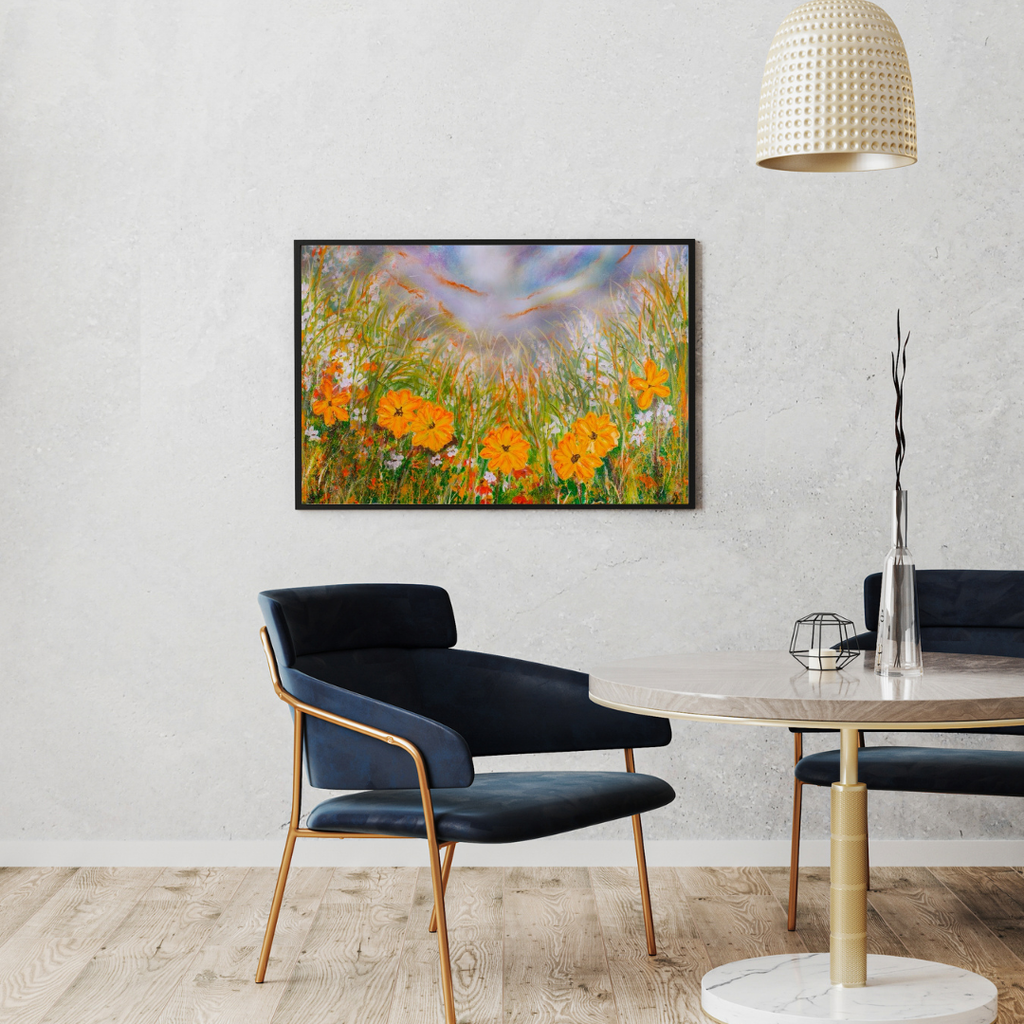 Framed wildflower wall art with orange and yellow flowers, green grass, and a blue sky.