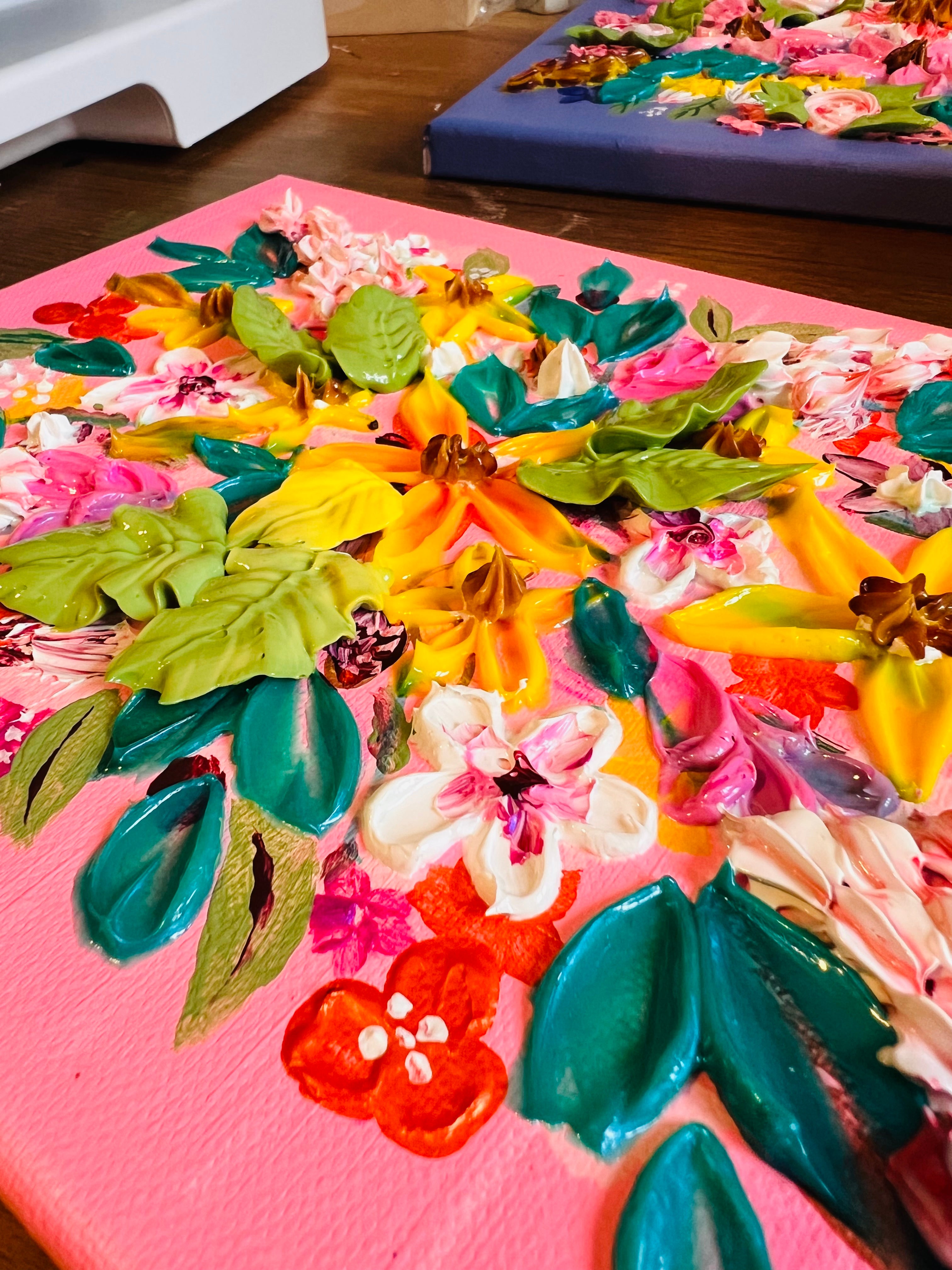 Framed heavy textured floral artwork close-up with bright orange, yellow, teal and pink