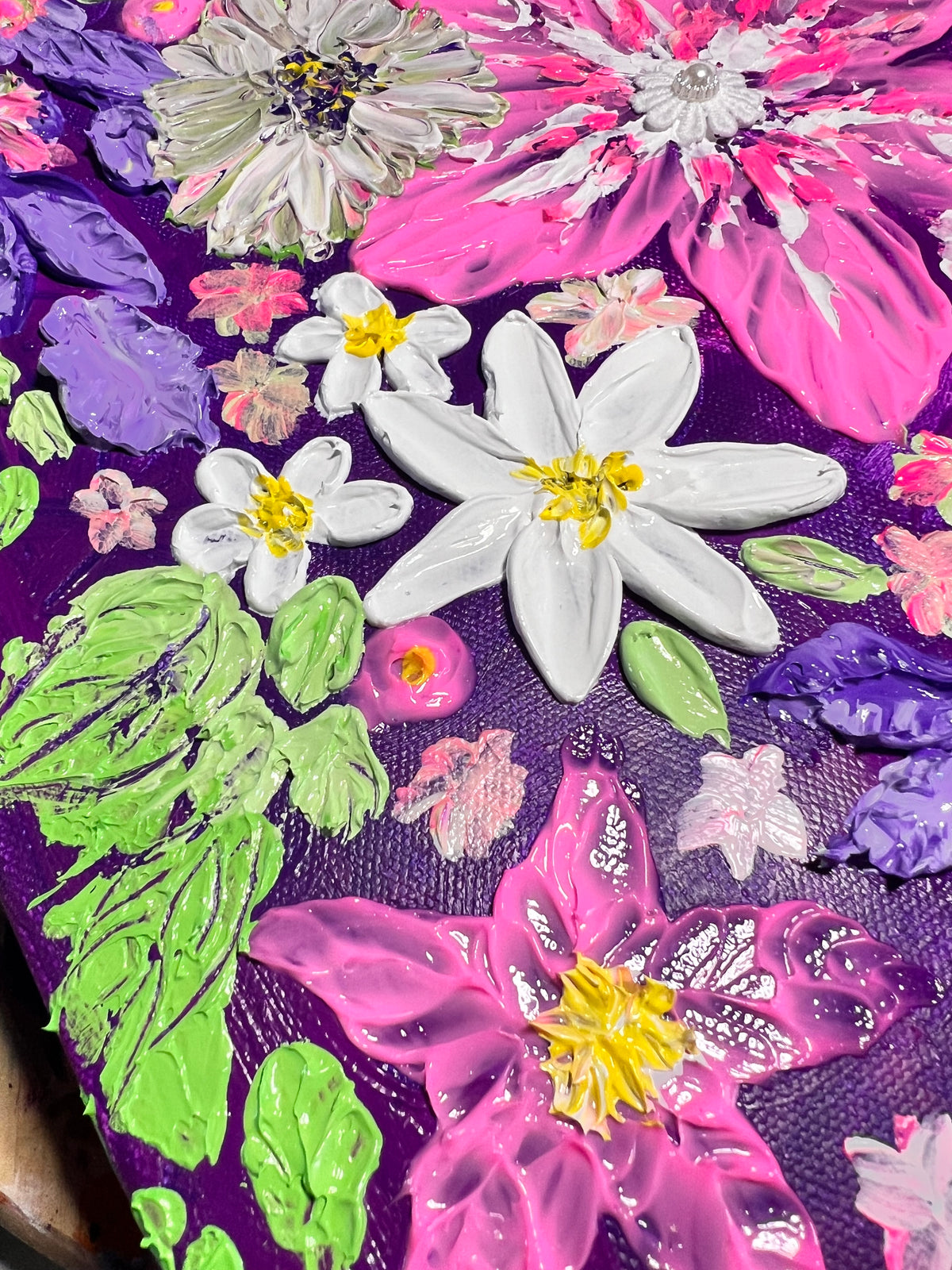 Thick texture floral art close-up with white daisies and pink petals, purple background, green accents