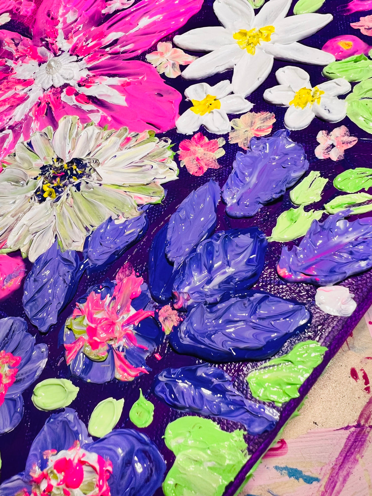 Thick texture floral art close-up with white daisies, pink petals, and blue layered leaves