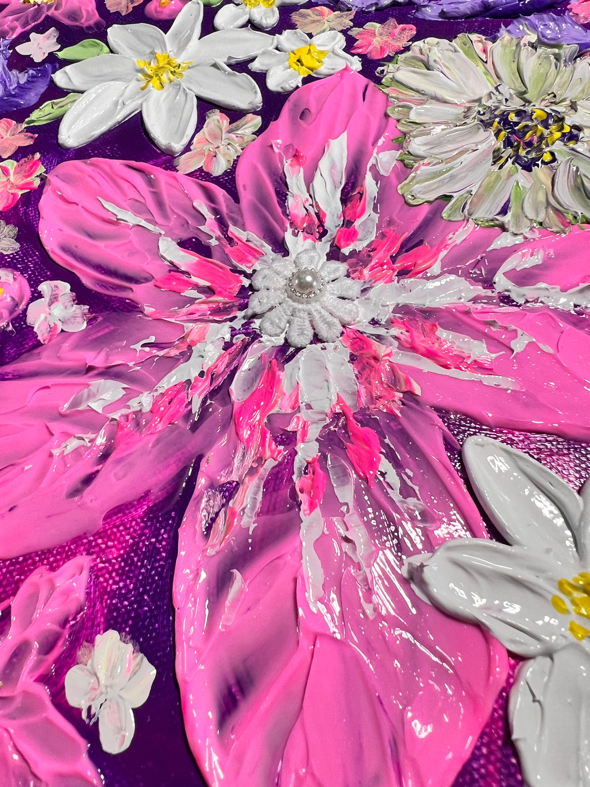 Thick texture floral art close-up with white daisies over glossy pink petals and blue background